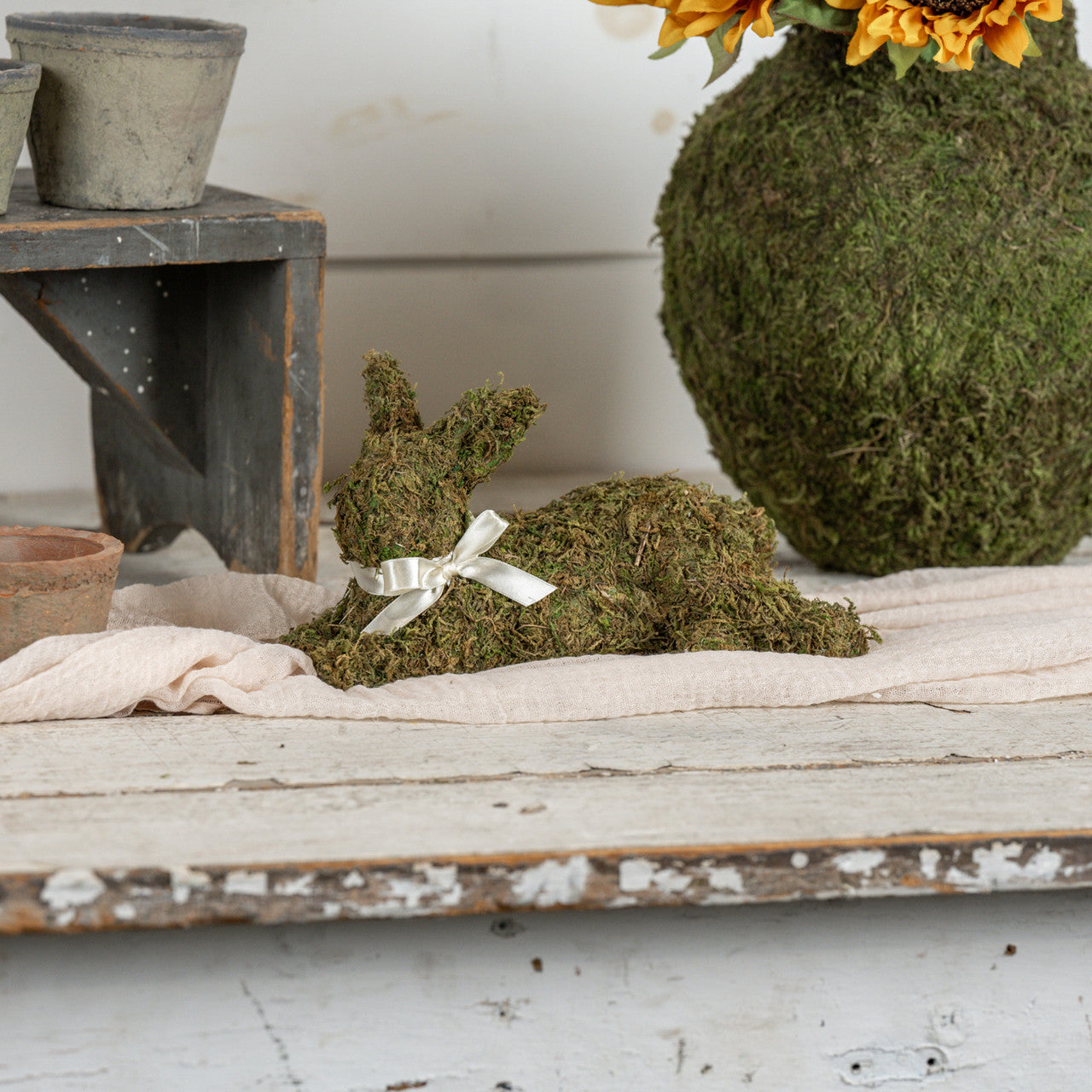 Laying Moss Bunny with Cream Bow